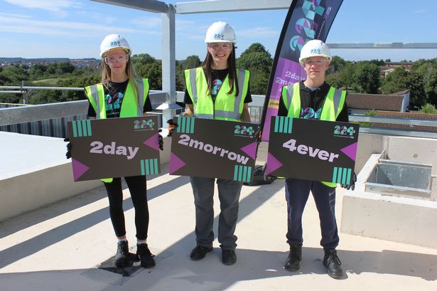 Members of Youth Moves' Young People's Development Group celebrate one year since the start of construction of the 224 Youth Zone