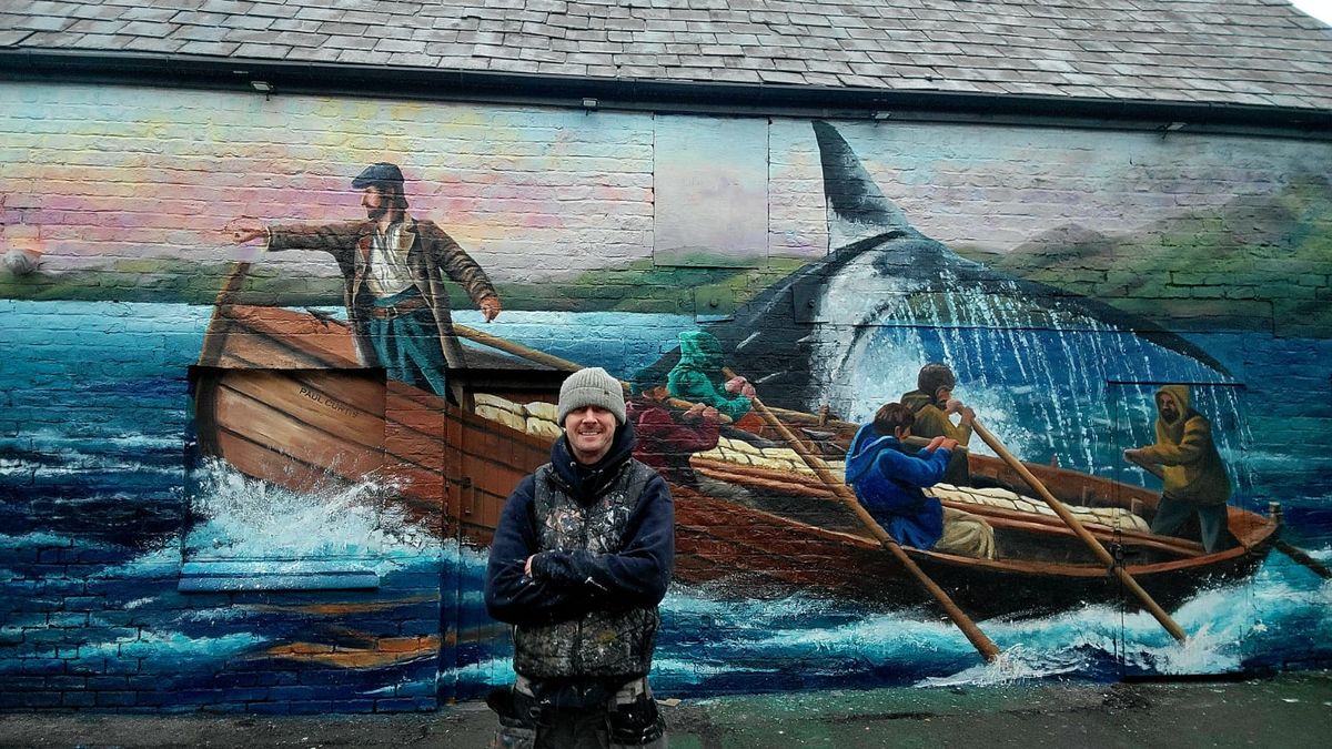 Artist Paul Curtis with his work at Bootle's Jawbone Tavern