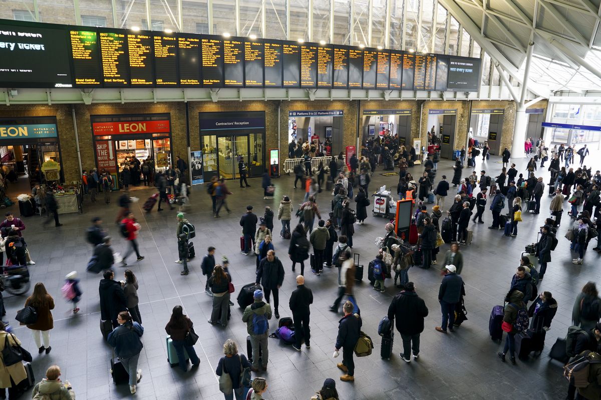 File photo dated 29/03/24 of passengers waiting for trains at London King's Cross Station. A cyber attack has hit public wifi at some of the biggest railways stations in the country, and reports say that Manchester Piccadilly, Birmingham New Street and 11 stations in London have all been affected by the attack on Wednesday, which saw passengers trying to log on seeing messages about terror attacks in Europe. Issue date: Thursday September 26, 2024.