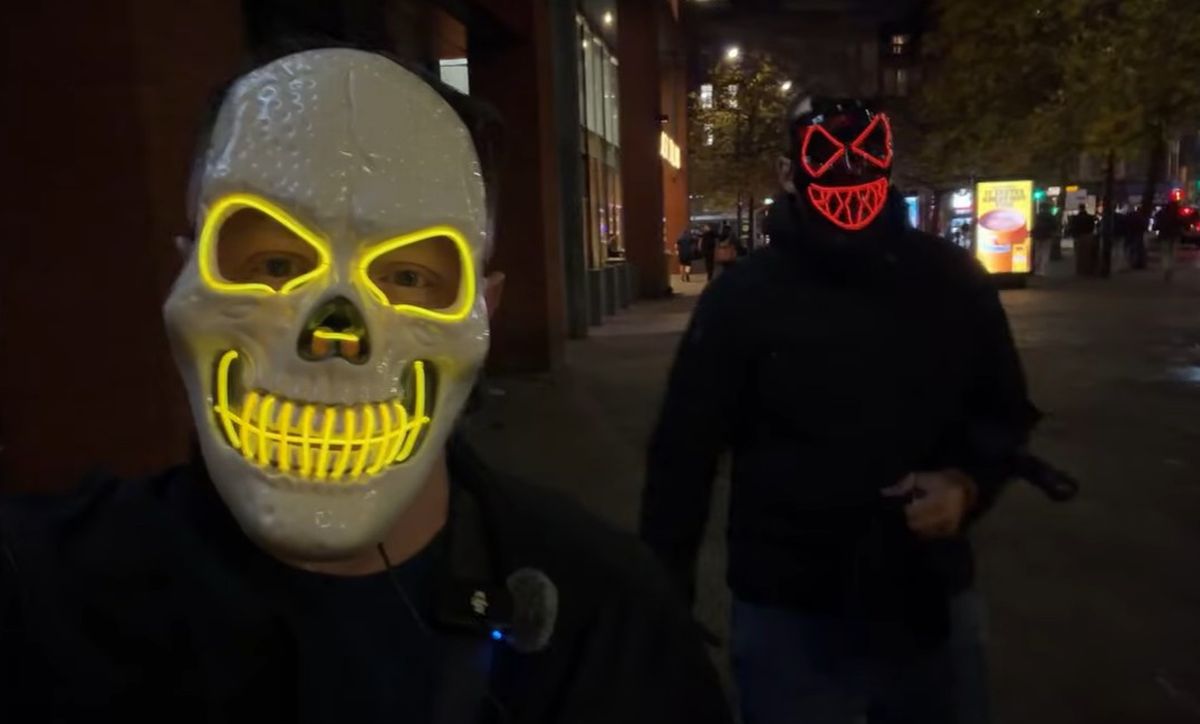 Curtis Arnold (left) in a Halloween mask