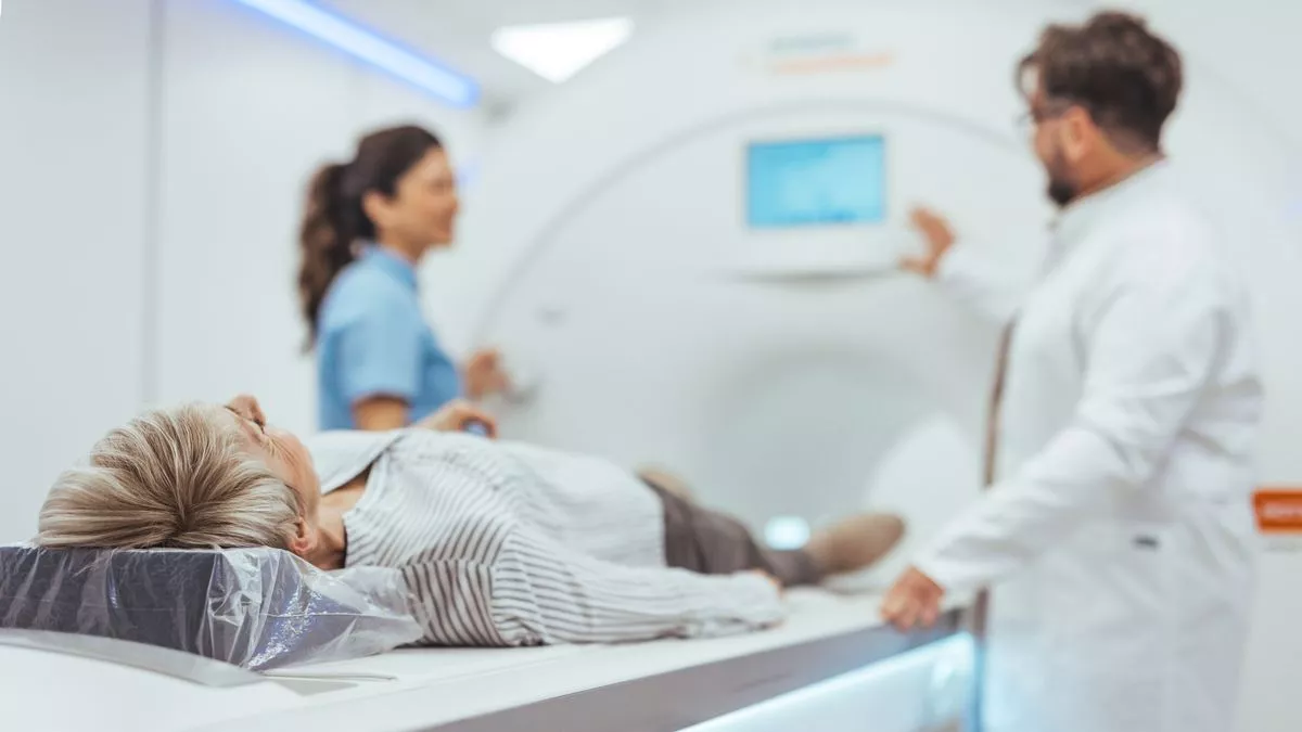 Woman having a scan in an MRI machine 