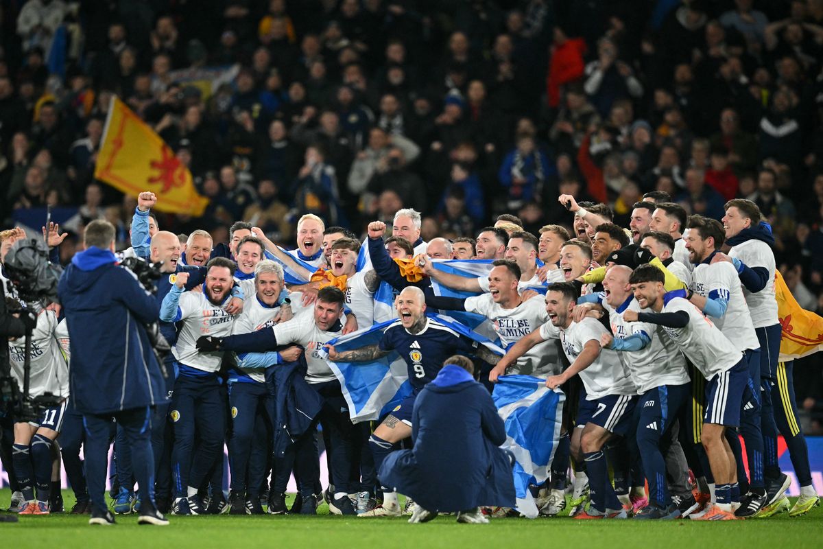 Scotland players celebrate on the pitch after the FIFA World Cup 2026 European qualification football match between Scotland and Denmark at Hampden Park in Glasgow on November 18, 2025