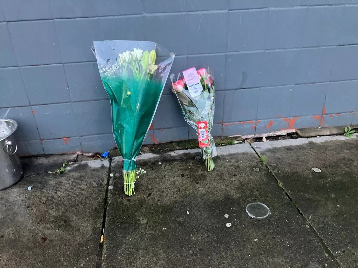 Floral tributes left outside Avenue Lounge Bar, Longmoor Lane, Fazakerley