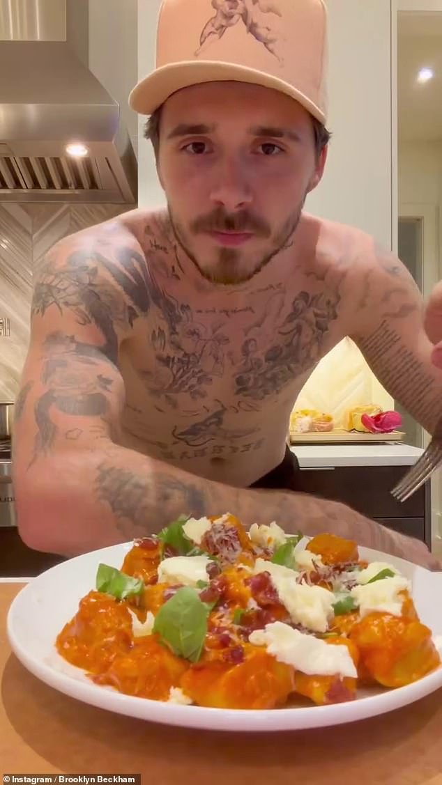 As he presented the finished product, the son of David and Victoria Beckham showed off his tattooed torso, having ditched his hoodie before pausing to taste the dish