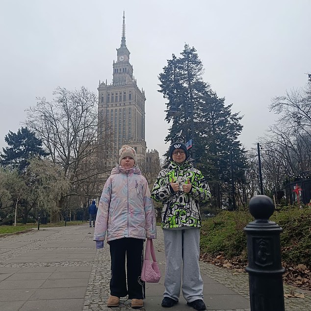 Mr Arnold's two children - Jason, 11 , and Maya aged nine - outside Warsaw's Palace of Culture and Science. He said that the move to Poland was most difficult for his son and daughter who found it 'a bit of a shock' to begin with