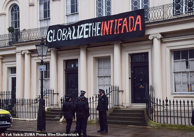 A banner carrying the slogan 'globalise the intifada' in Regent's Park, central London