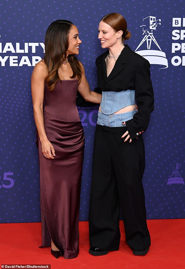 The pop star's two piece featured a denim panels and a boned corset which was teamed with a traditional black blazer and trousers