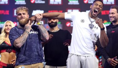 Anthony Joshua pretends to punch a smiling Jake Paul ahead of their £140m Miami showdown