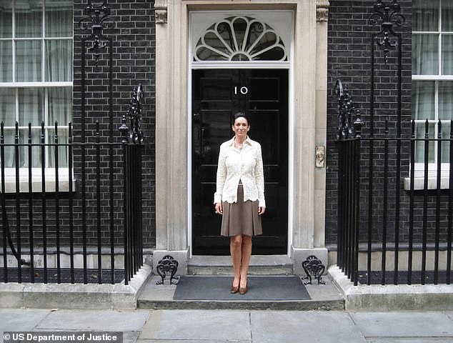 Maxwell poses for a photograph outside Number 10 Downing Street