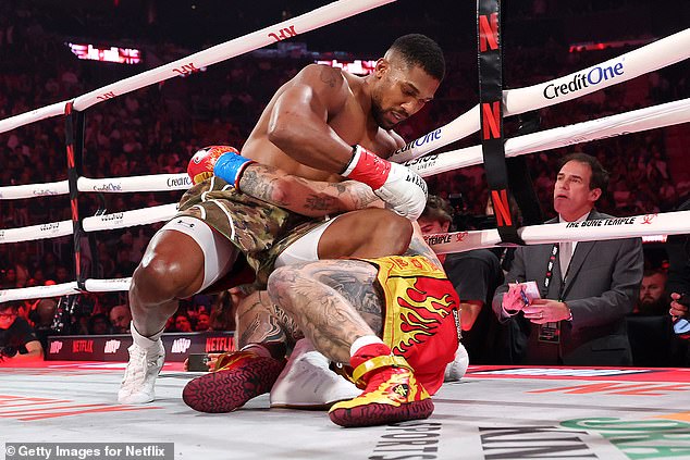 Anthony Joshua ends up on the canvas with Jake Paul - but went on to win the fight