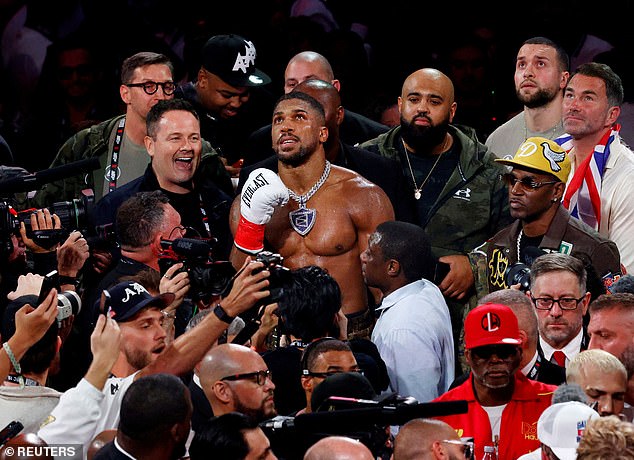 Joshua celebrates as he makes his way back to the dressing rooms after the Netflix showdown