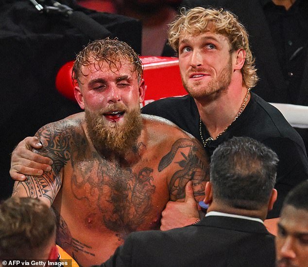 Logan Paul (R) was heard chirping at Anthony Joshua during his bout with Jake Paul (L)