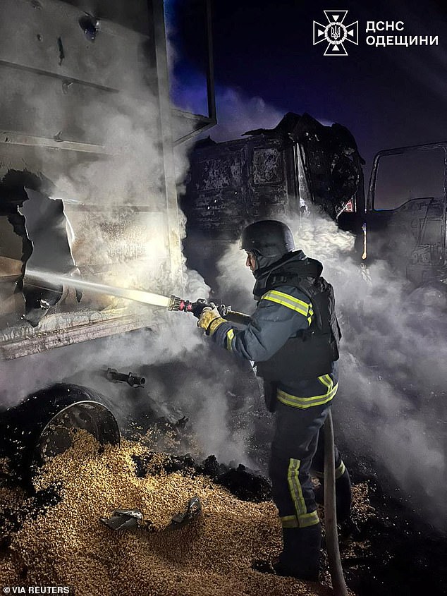 A firefighter works at the site of a Russian missile and drone strike, amid Russia's attack on Ukraine, in Odesa region