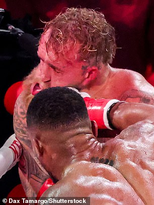 Jake Paul (top) suffered a bruising boxing defeat on Friday