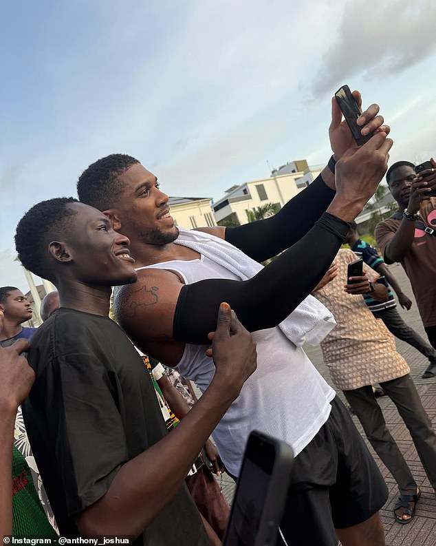 The tattoo of the African continent on Joshua's arm has Nigeria's place on the map outlined