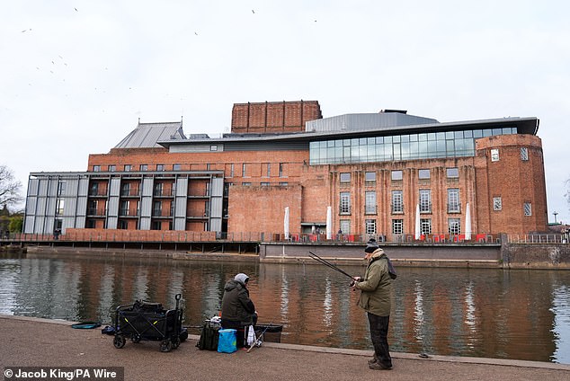 Fishermen by the RSC Theatre in Stratford-upon-Avon in Warwickshire yesterday