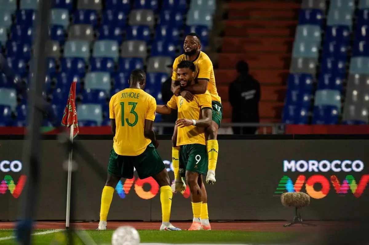 South Africa's Lyle Foster celebrates after scoring a goal during the Africa Cup of Nations group B soccer match between Angola and South Africa in Marrakech, Morocco, Monday, Dec. 22, 2025. (AP Photo/Themba Hadebe)