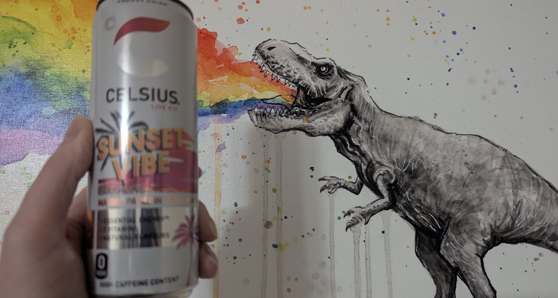 Celsius can in front of dinosaur painting