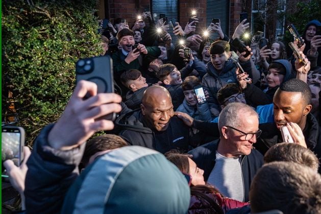 Mike Tyson: Boxing champion mobbed by fans after visiting pal’s home in Belfast