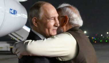 Vladimir Putin (L) and Narendra Modi embrace at Palam Air Base in New Delhi, India. Pic: Kremlin Pool/AP