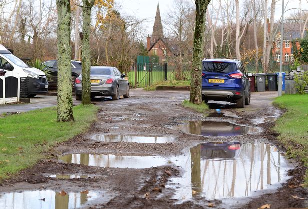 Waterlogged pothole covered Homer Road.