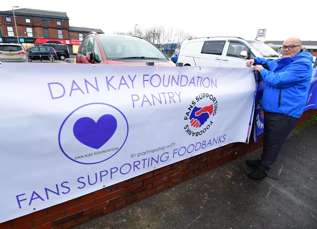 Dave Kelly, founder of Fans Supporting Foodbanks, with the Dan Kay Foundation Pantry banner (Pic Andrew Teebay)
