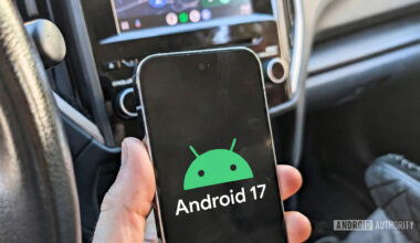 Android 17 logo on a Pixel phone held in a car 2