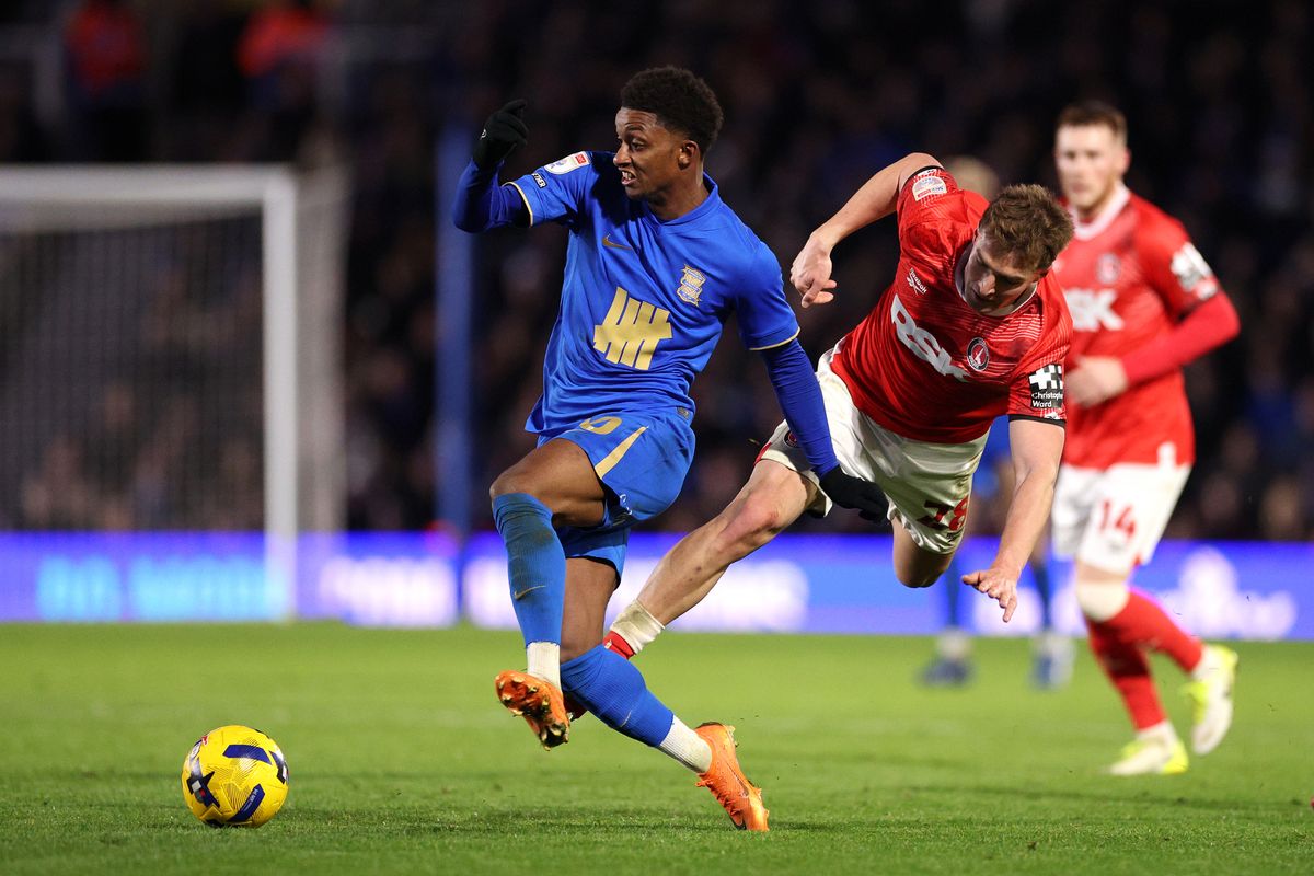 Demarai Gray of Birmingham City is challenged by James Bree of Charlton Athletic 