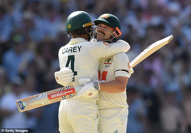 ADELAIDE, AUSTRALIA - DECEMBER 19: Travis Head of Australia celebrates with Alex Carey after reaching his century during day three of the Third Test Match in the 2025-26 Ashes Series between Australia and England at Adelaide Oval on December 19, 2025 in Adelaide, Australia. (Photo by Philip Brown/Getty Images)