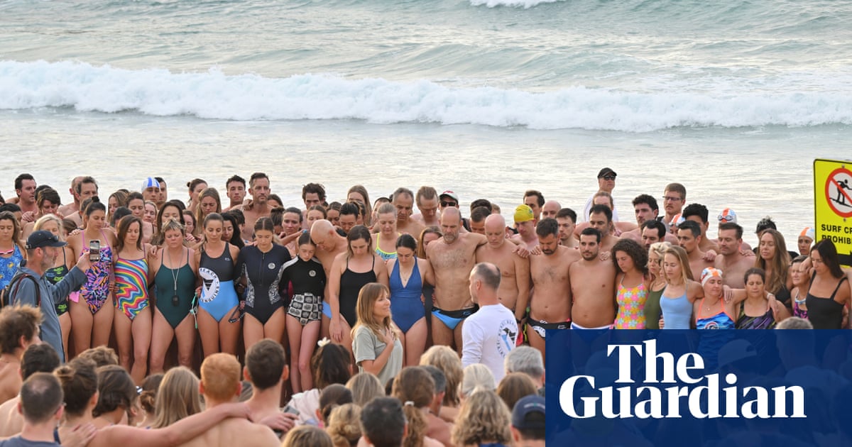 A swim for unity at Bondi beach, the scene of Sydney’s darkest day. But on land tensions fray | Bondi beach terror attack