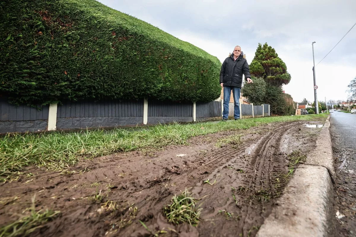 The torn-up grass verge outside Clive Patterson's home on Old Wood Road in Pensby