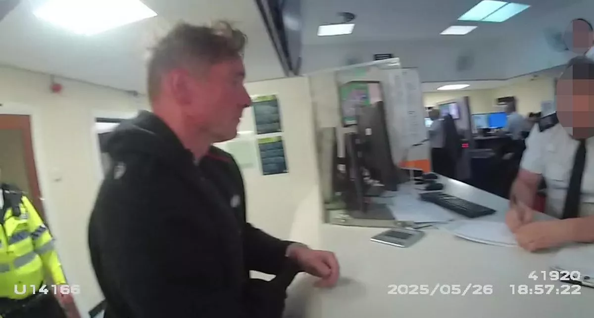 Police bodycam footage of Paul Doyle being taken to the custody suite after his arrest