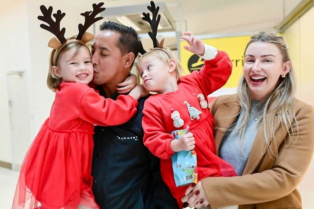 Belfast City Airport: Christmas reunions with hugs and homecomings: ‘Now that he’s here, the family’s complete again’