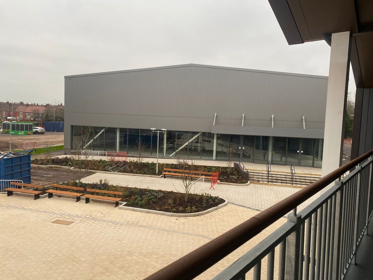 The large grey building on the Grayson Place development will play home to the indoor padel tennis courts