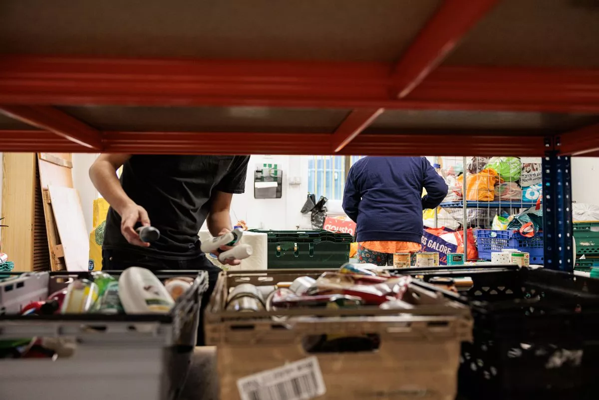 Volunteers sort donations at Salford Foodbank
