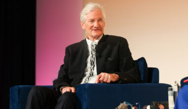James Dyson discussing inheritance tax reforms at a business conference podium, emphasizing economic impacts.