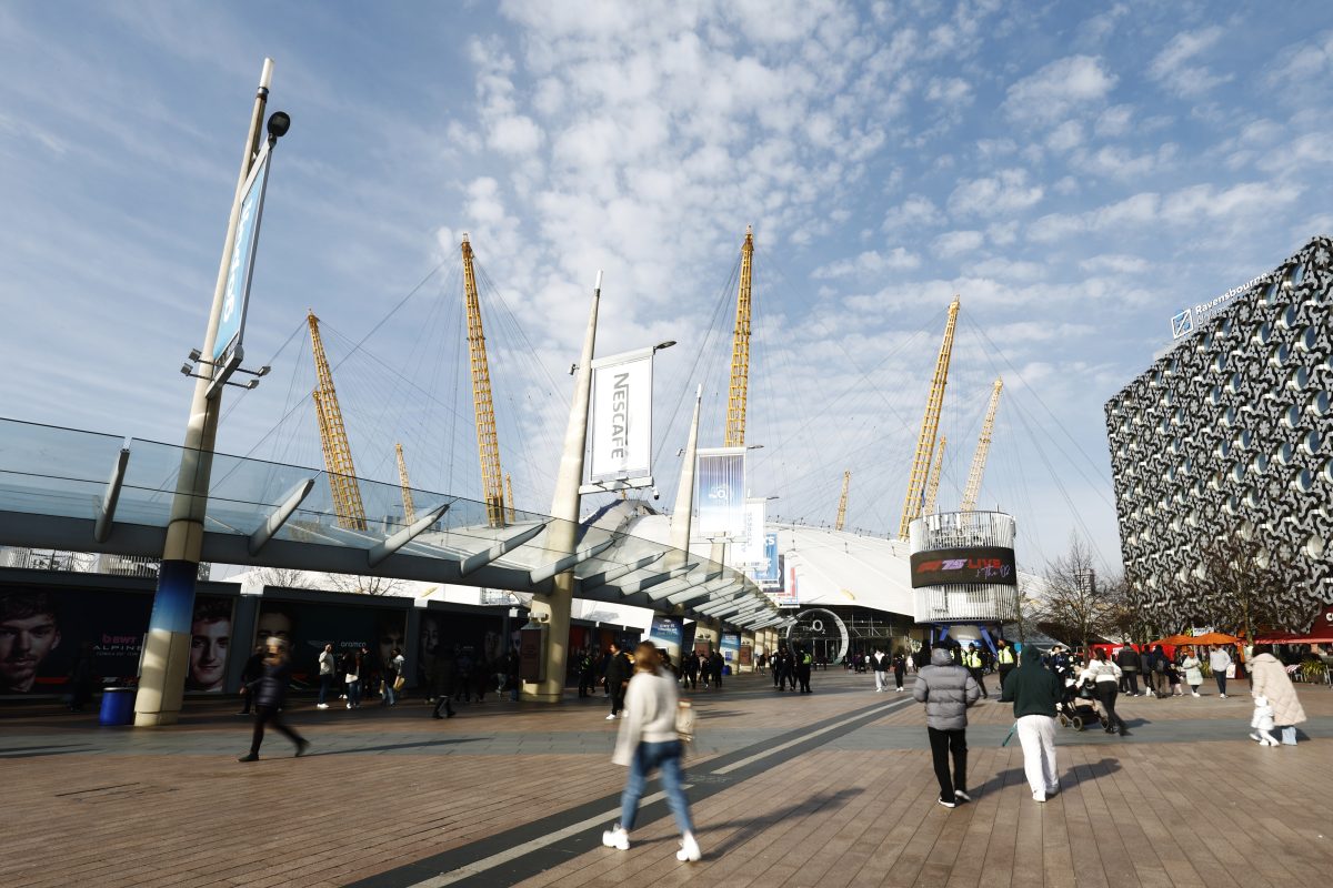 GettyImages 2200386037 showing a diverse group of business professionals in a modern office setting discussing strategic p...