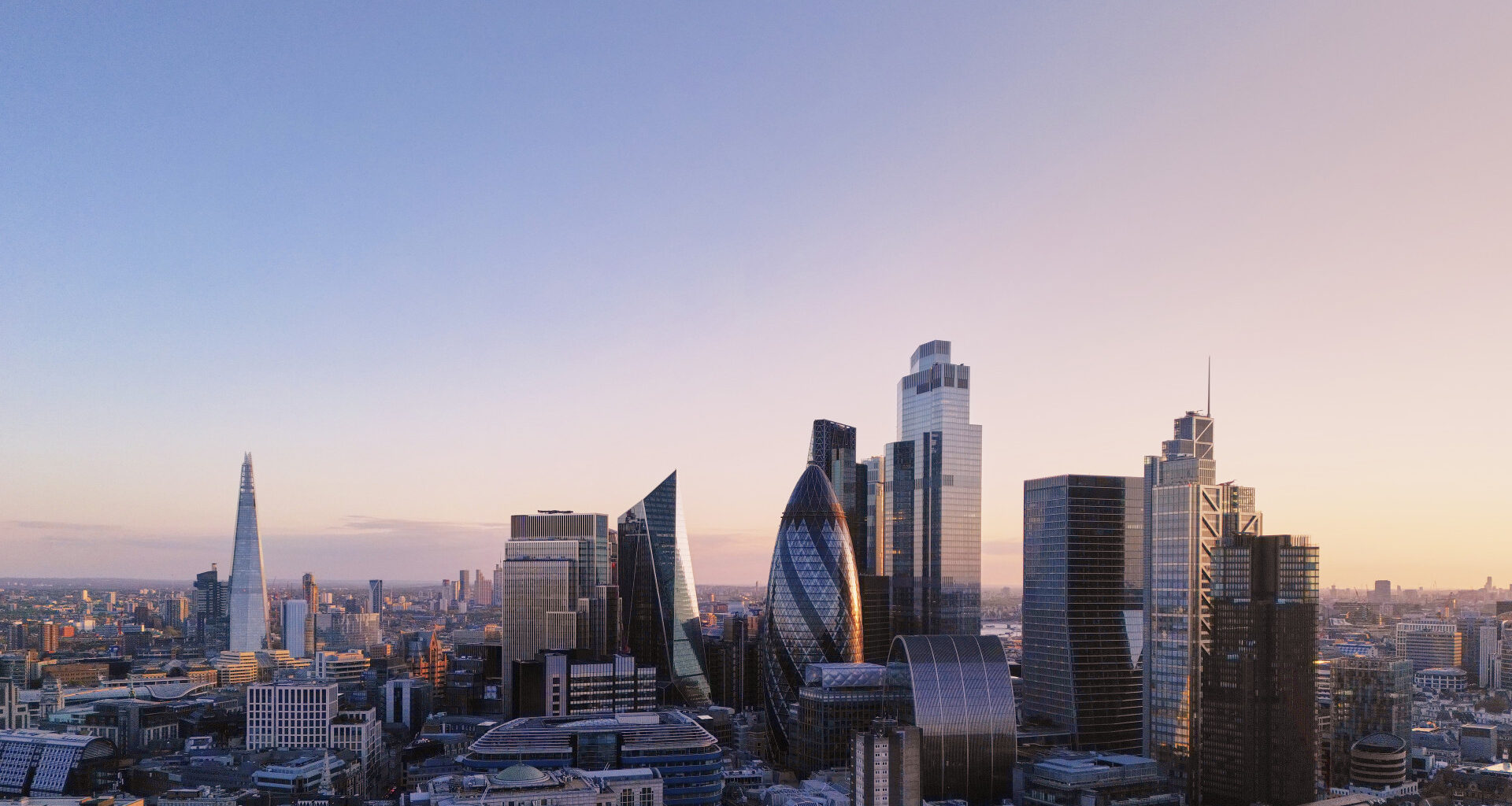 Elevated view over London's city financial district skyline at sunset