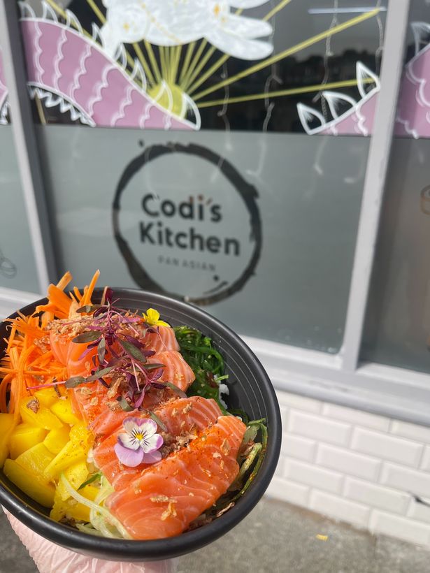 A sushi bowl in front of Codi's Kitchen in Prestwich 