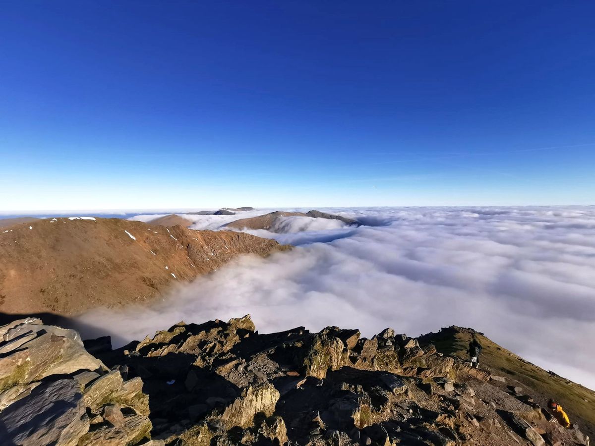 A temperature inversion seen from Yr Wyddfa ( Snowdon), trapping cloud below the peak