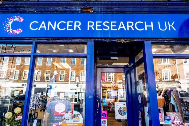 Epsom Surrey London UK, March 19 2022, Cancer Research UK High Street Charity Shop Entrance With No People