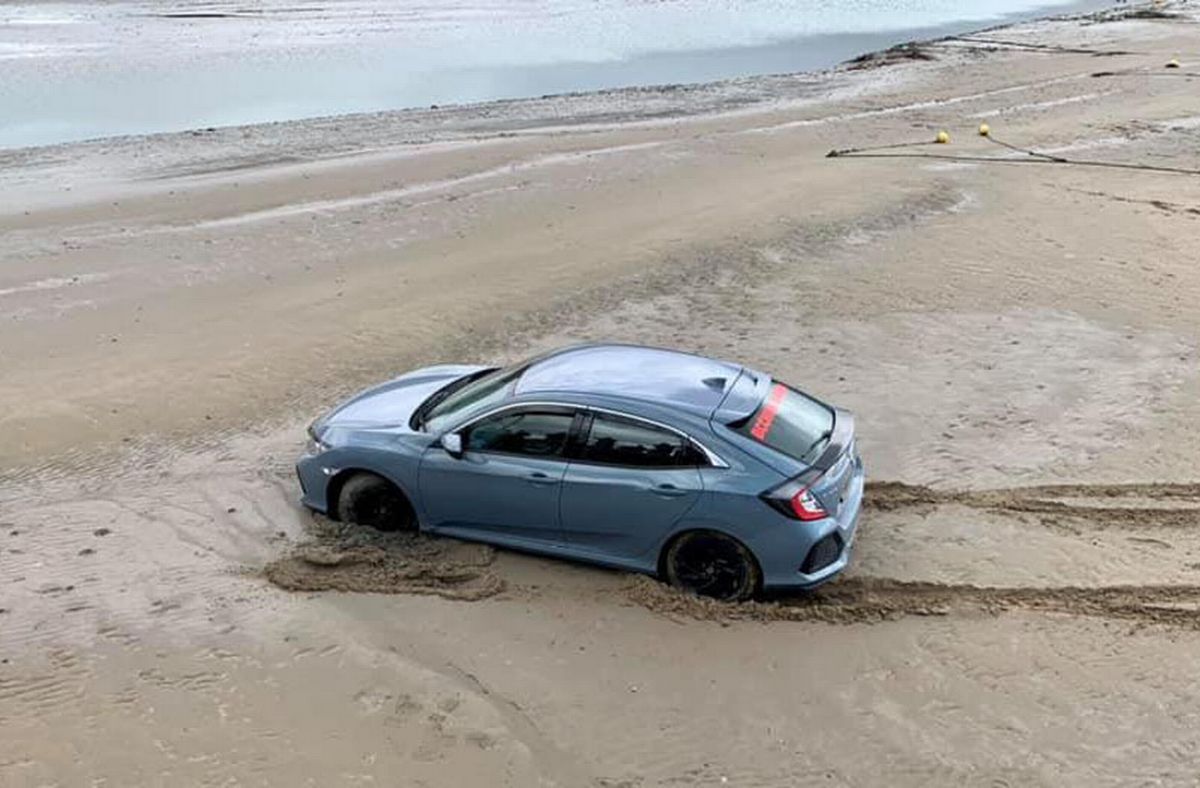 A stranded Honda Civic was hauled off  Barmouth beach in April 2021