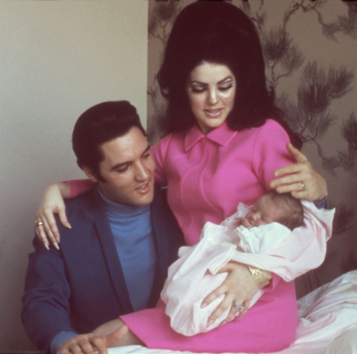 A picture of Elvis Presley with his wife Priscilla and a newborn Lisa Marie Presley 