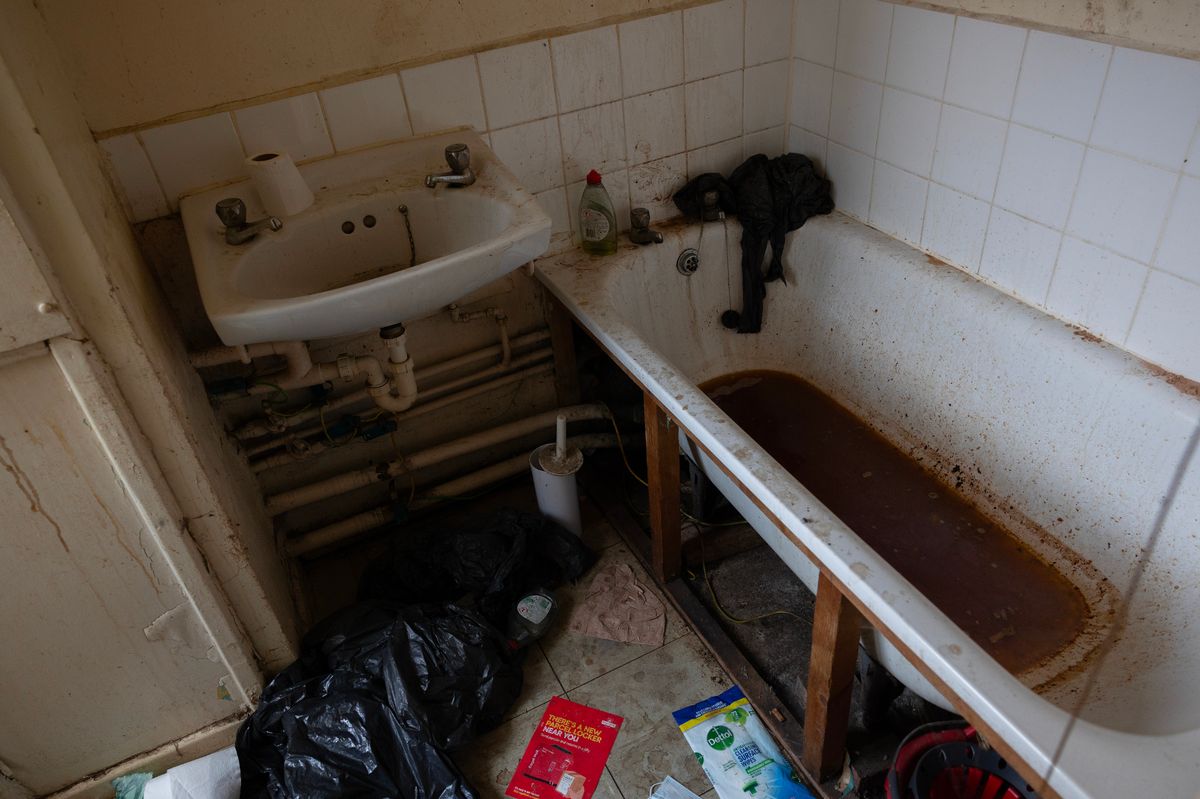 A dirt bathtub seen in a Camden Council flat in Holborn, North London, UK