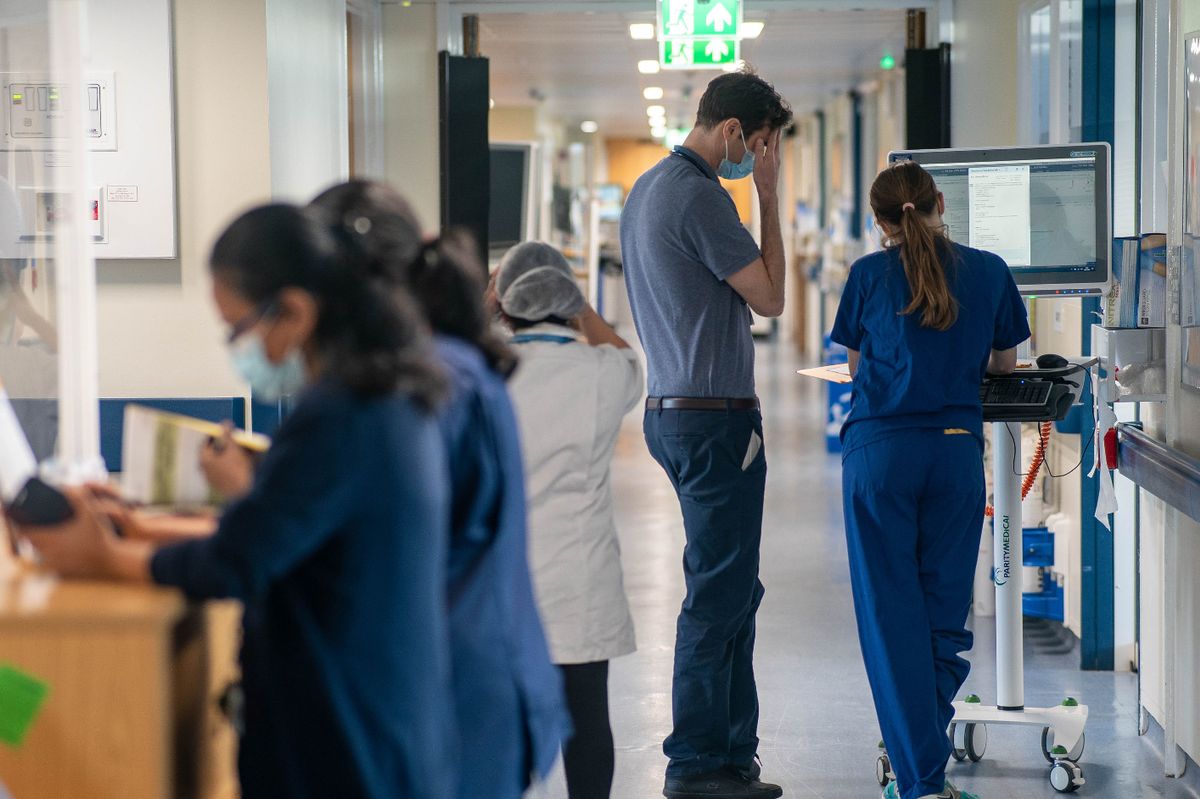 The number of people in hospital in England with flu remains at a record level for this time of year and has jumped by 55% in a week, NHS figures show