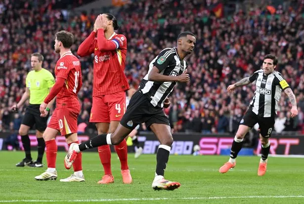 Newcastle United player Alexander Isak celebrates after scoring the second goal as Liverpool captain Virgil van Dijk reacts dejectedly during the Carabao Cup Final between Liverpool and Newcastle United at Wembley Stadium on March 16, 2025 in London, England.