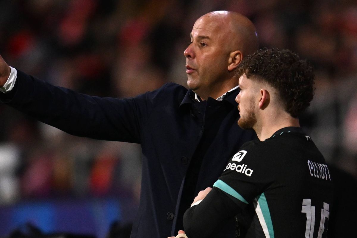 Arne Slot, Manager of Liverpool, interacts with Harvey Elliott of Liverpool as he prepares to enter the pitch during the UEFA Champions League 2024/25 League Phase MD6 match between Girona FC and Liverpool FC at Montilivi Stadium on December 10, 2024 in Girona, Spain. 