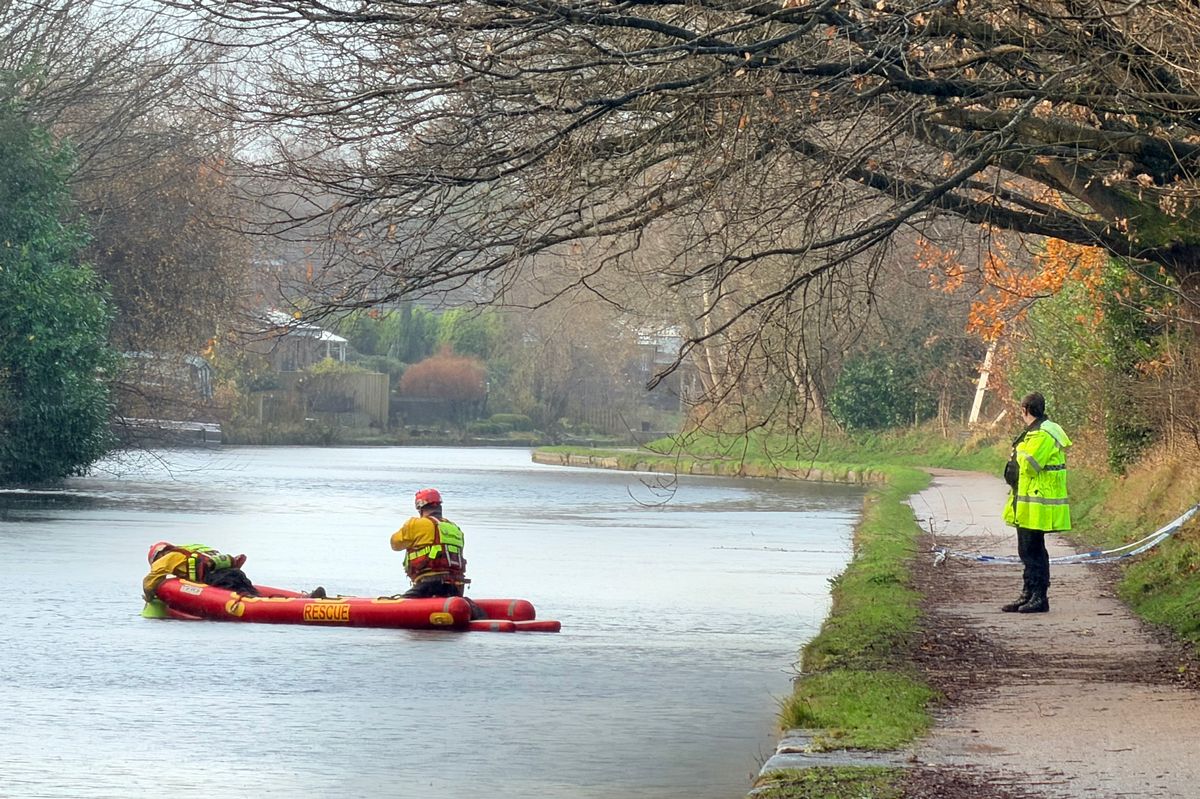 Police and divers at the scene in Altrincham