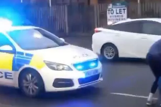 Police at the scene on Ashton Old Road