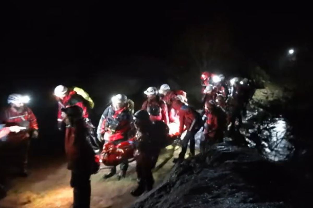 Two walkers were found shivering in cold and wet conditions by rescue teams